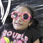children getting treatment wearing cool sunglasses to protect eyes from the bright light