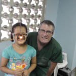 Dr. Bryan and one of the children